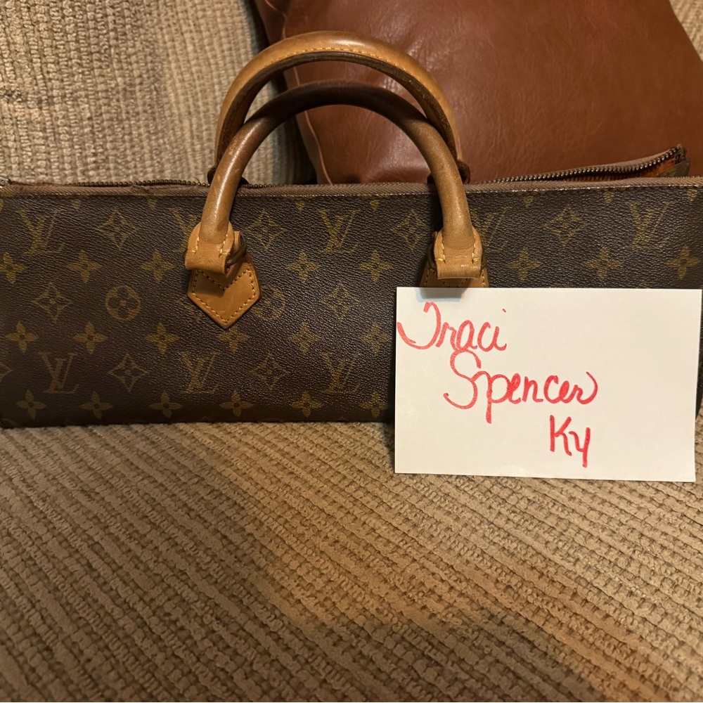 Louis Vuitton Monogram Canvas triangle bag